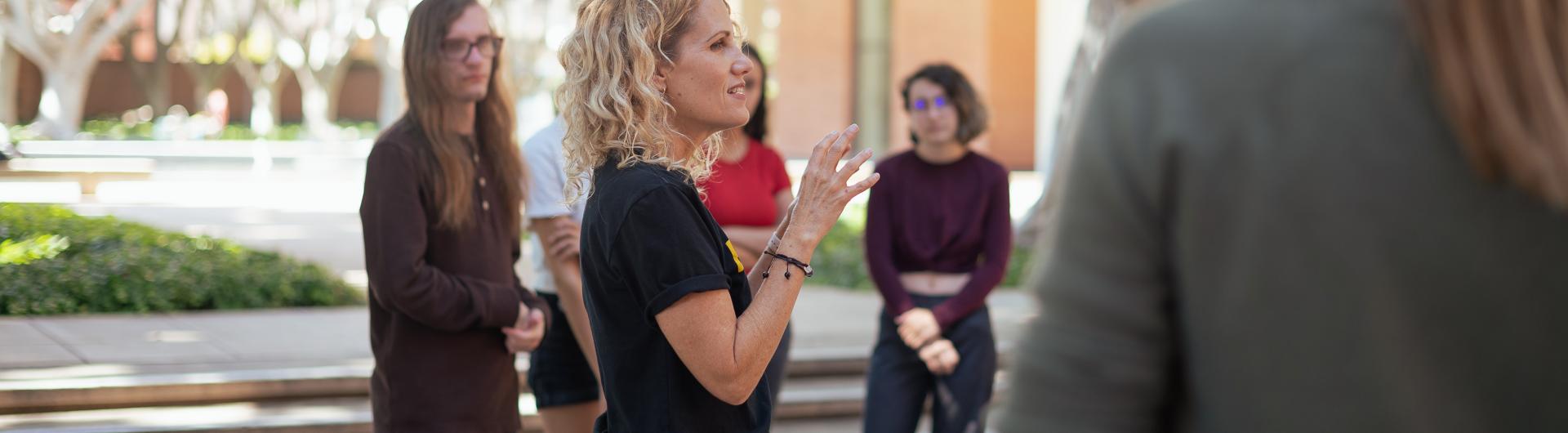 Jen Richardson, Theatre Arts Faculty, teaches class outdoors