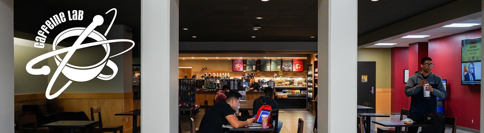 Students drinking beverages at Caffeine Lab