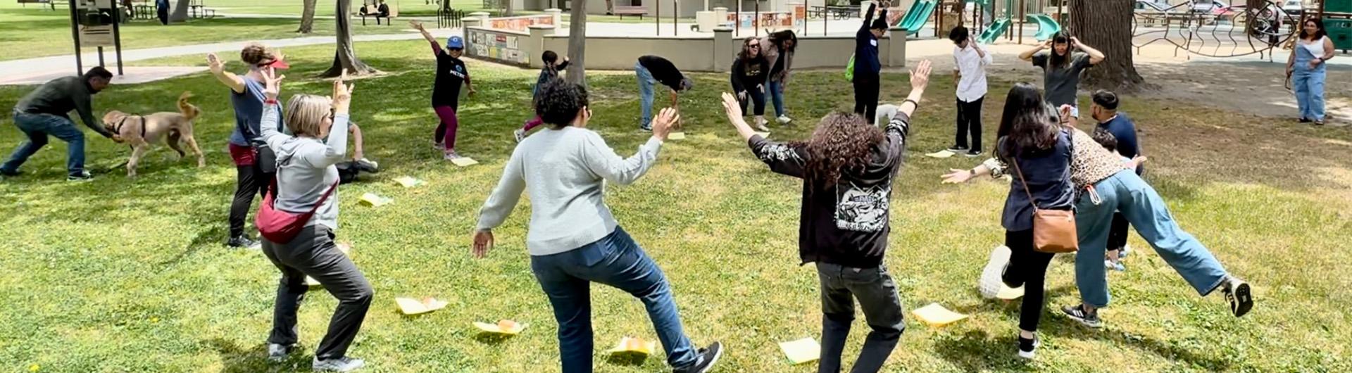 people doing silly poses in the park