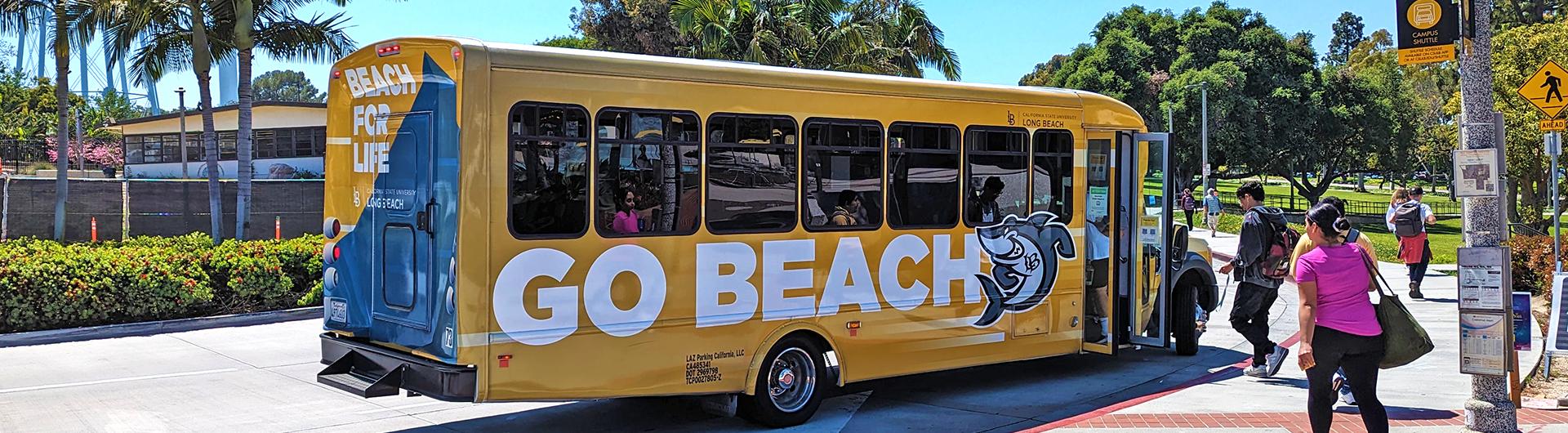 Campus shuttle stopped at curb