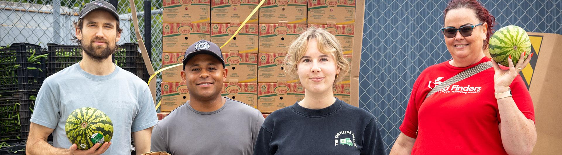 Hailey Wesling, center, and Farmlink Project workers