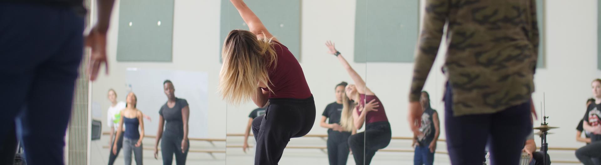 Dancers practice in a dance studio