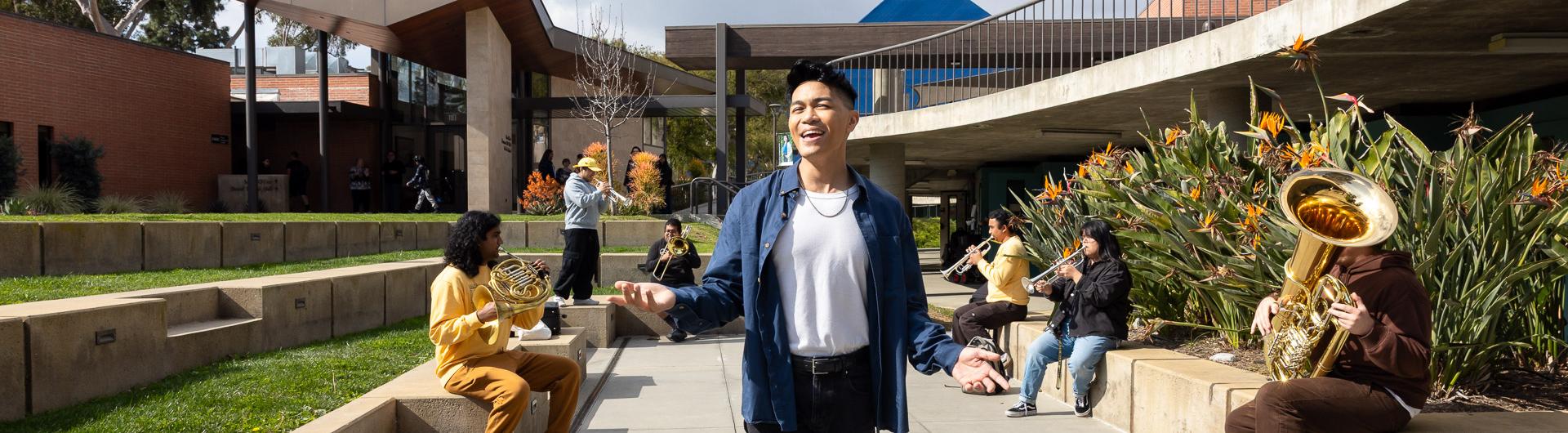 VJ Rosales sings outside the Bob Cole Conservatory of Music