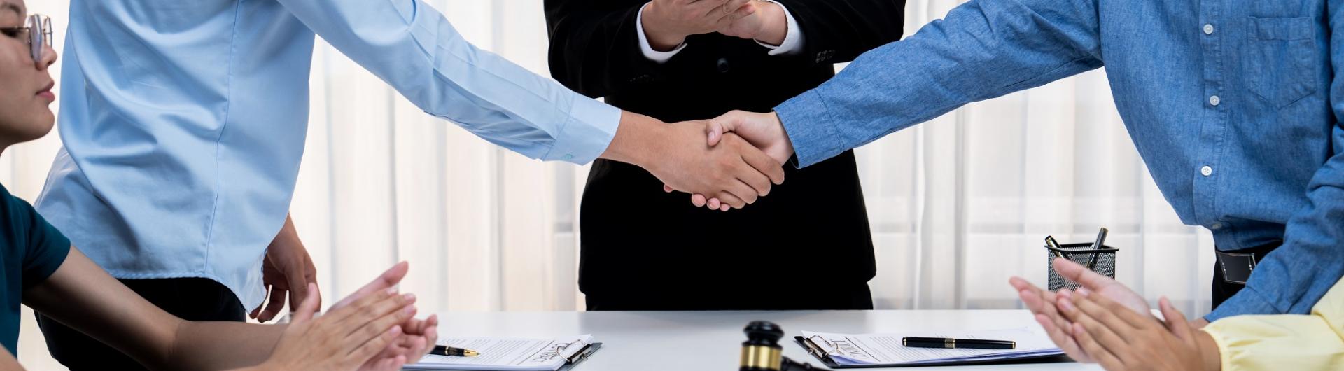 Handshake with Law indicated