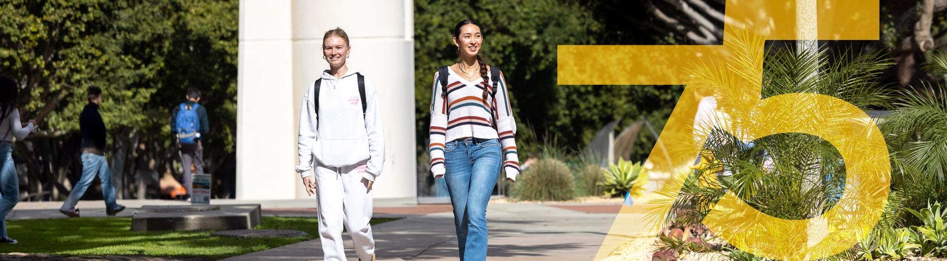 Students walking on campus with the number 75 next to them