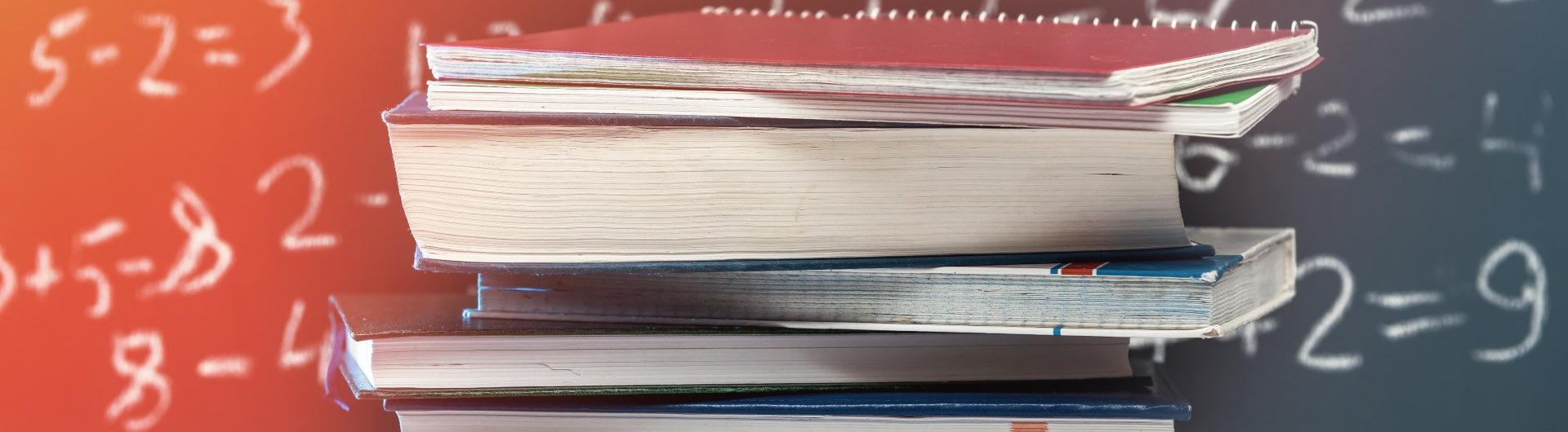 Stock image of books and a chalkboard