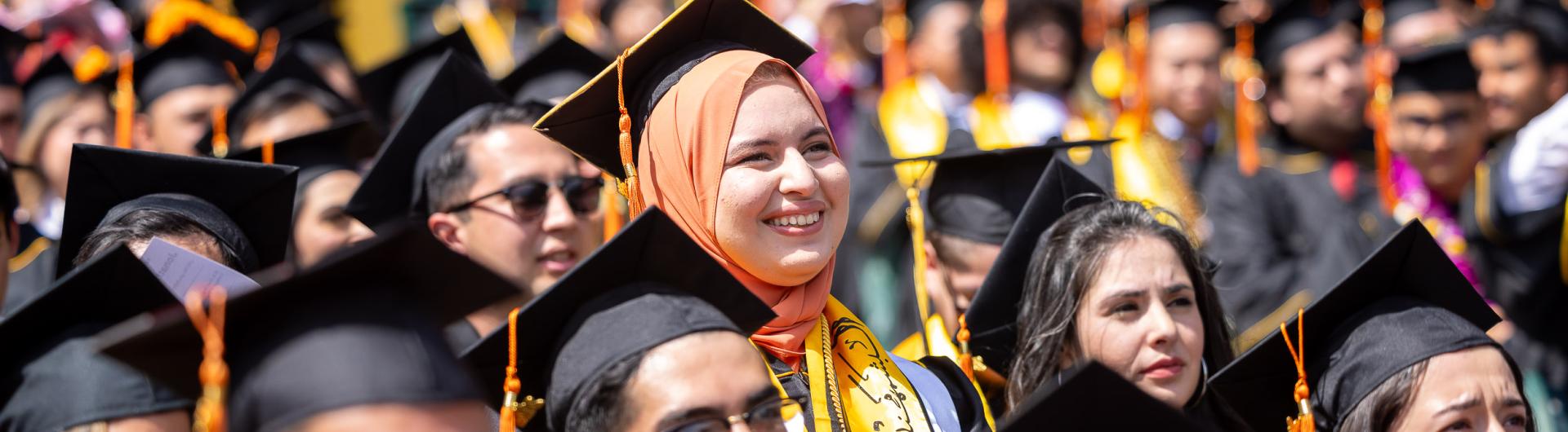 A diverse crowd of graduates at Commencement