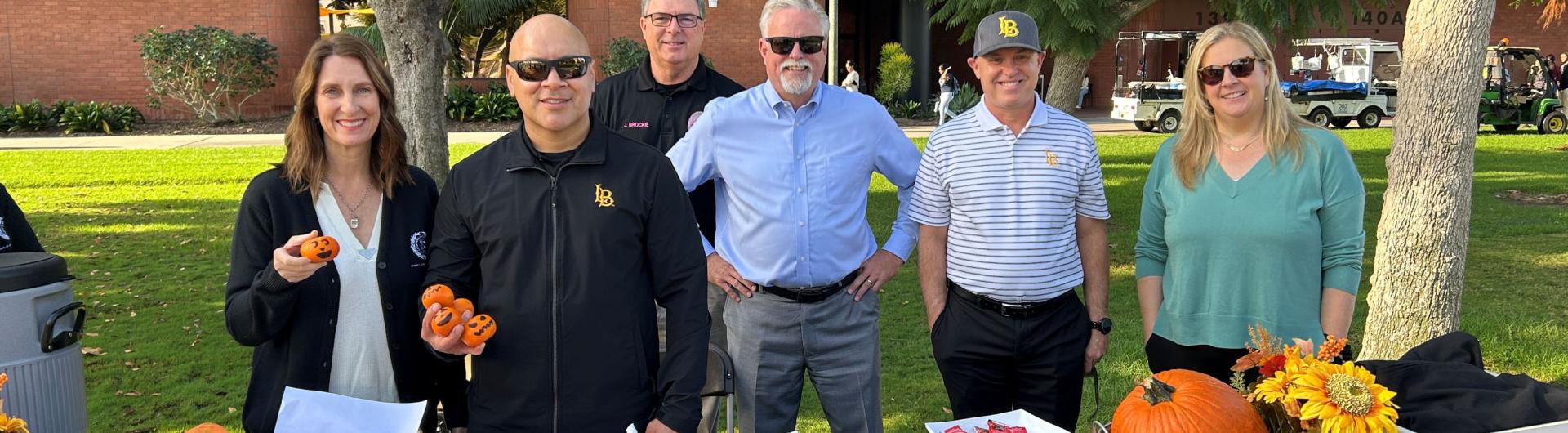 Staff from the Division of Finance and Administration standing in front of the College of Business