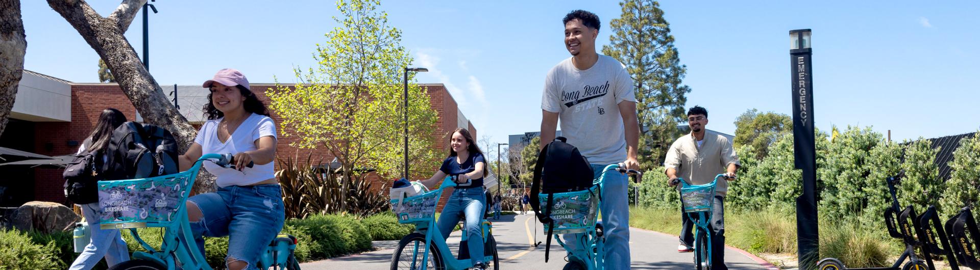 Students riding bikes on campus