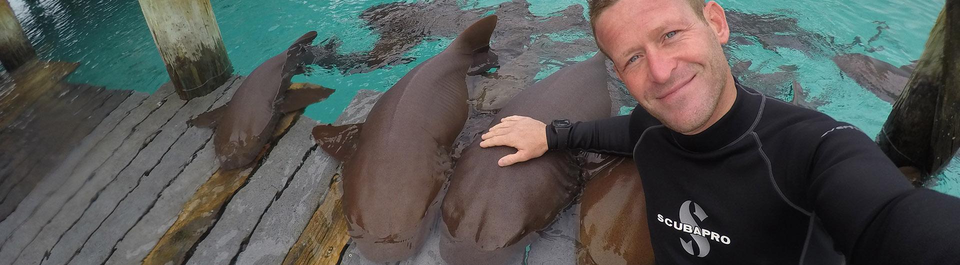 Andrew Casagrande poses with sharks