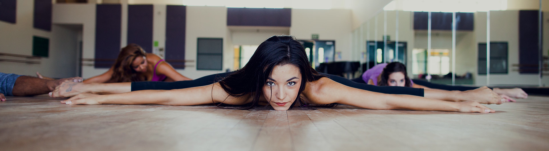 Dancers lie across floor