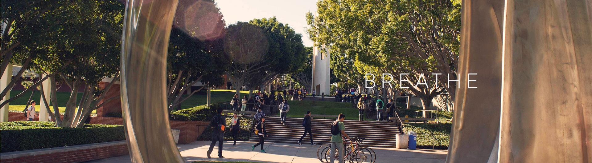 Students walking across an open space.