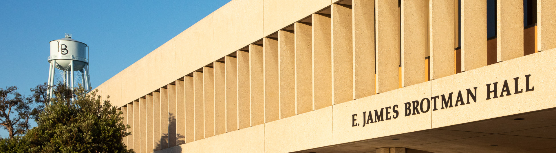 Brotman Hall entrance with CSULB water tower in background
