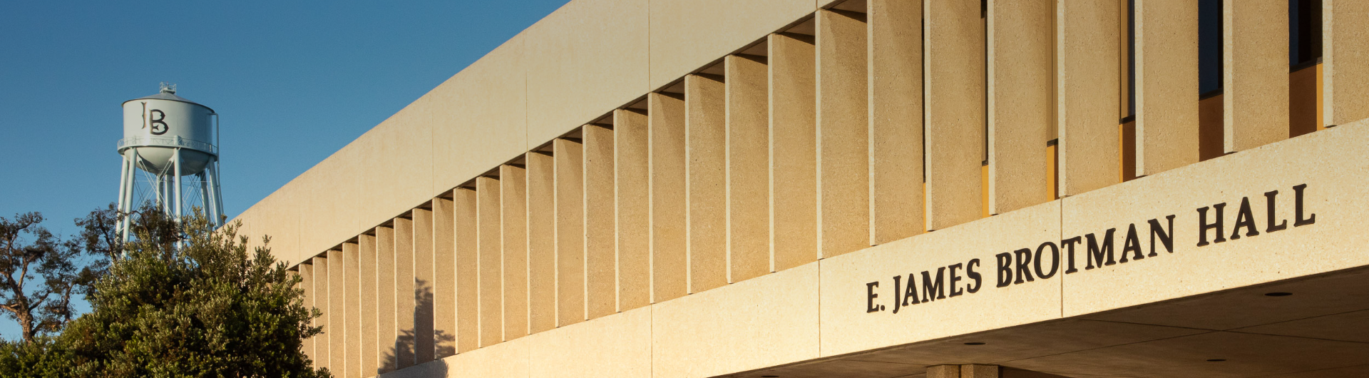 Brotman Hall entrance with CSULB water tower in background