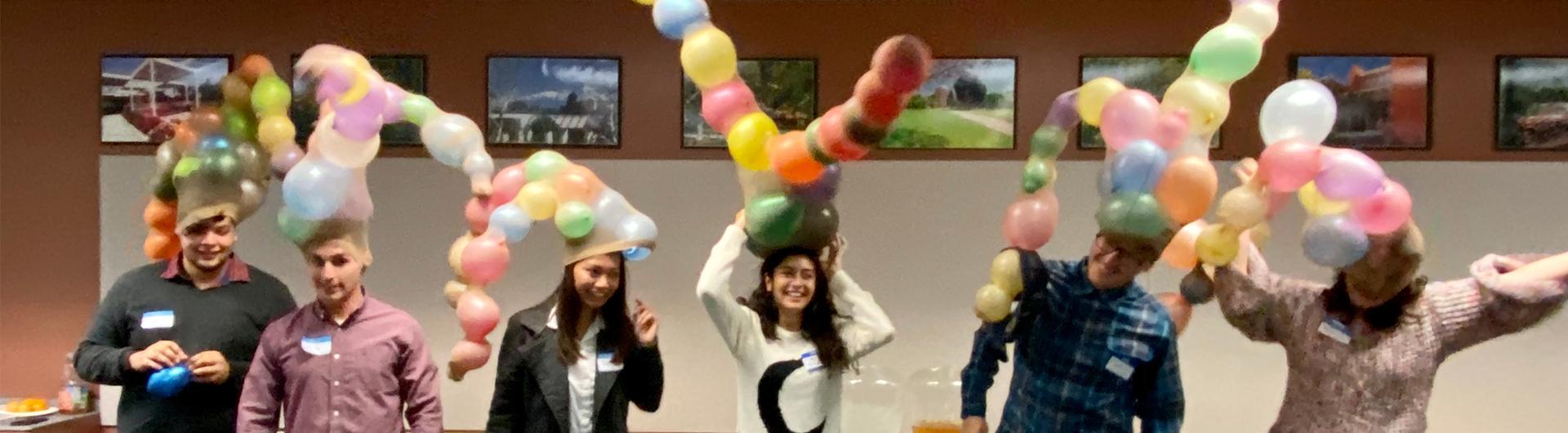 students wearing balloon hats