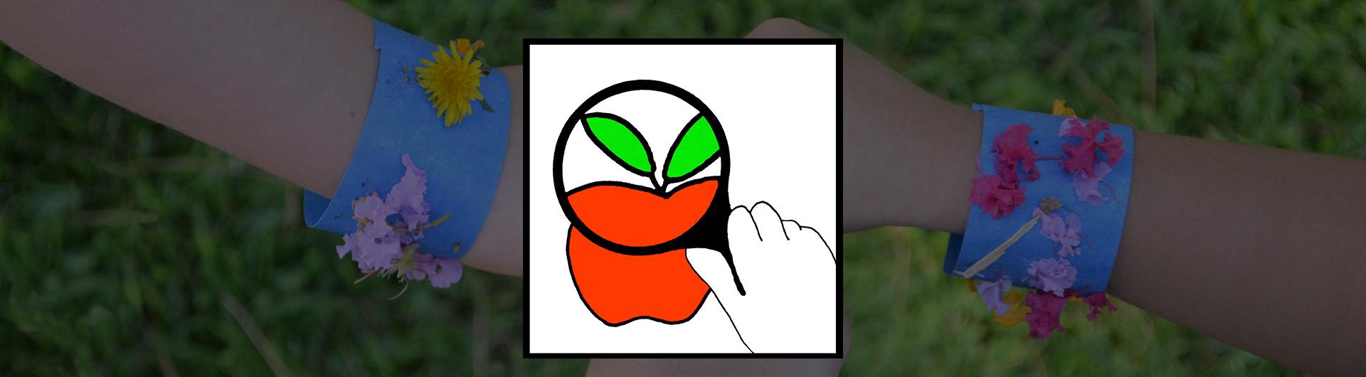 holding a magnifying glass up to an apple