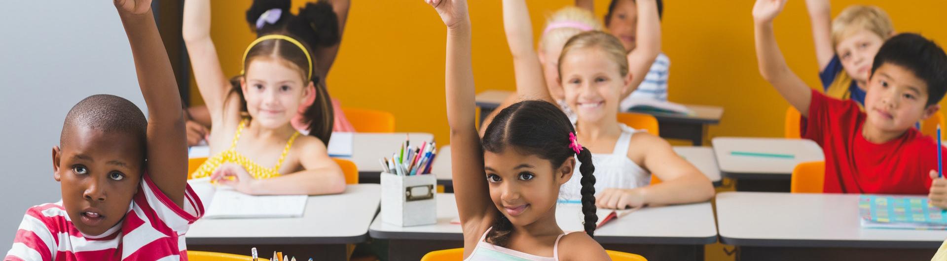 Children Raising hands classroom