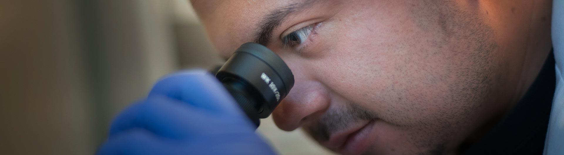 Student working on microscope