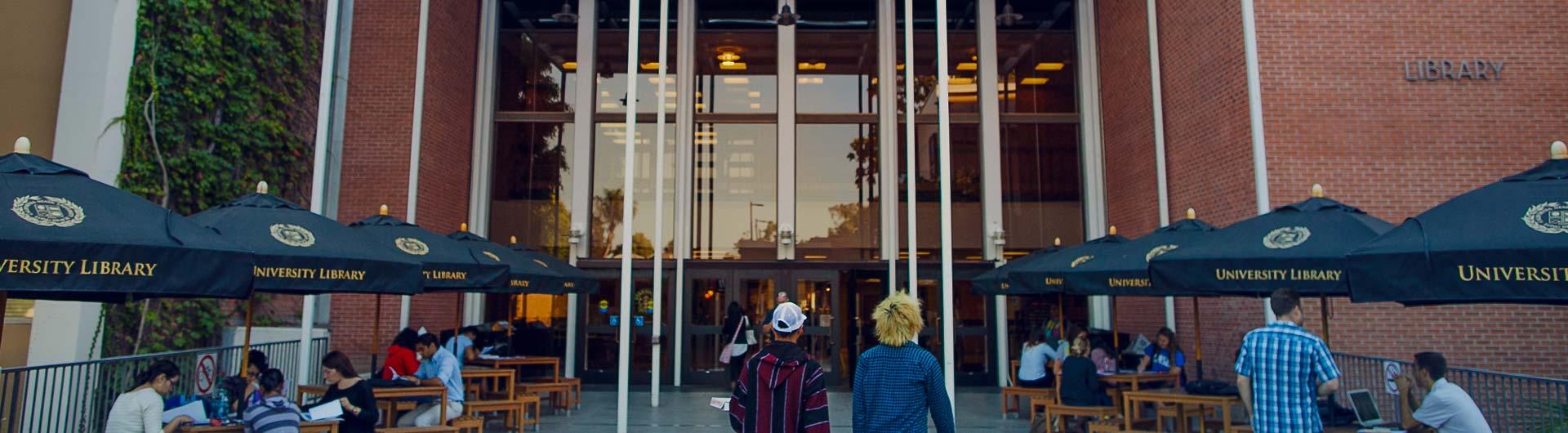 Students walk into the University Library