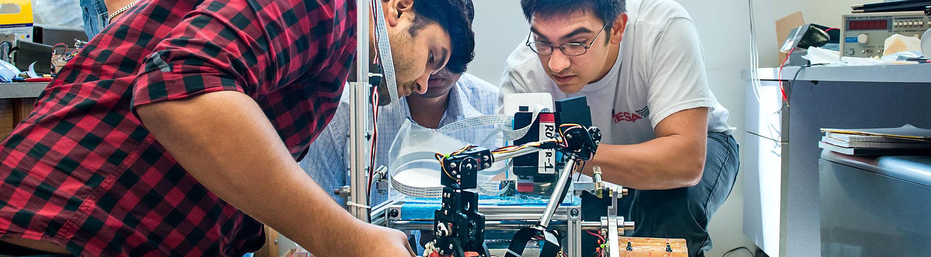 Students work on a rover