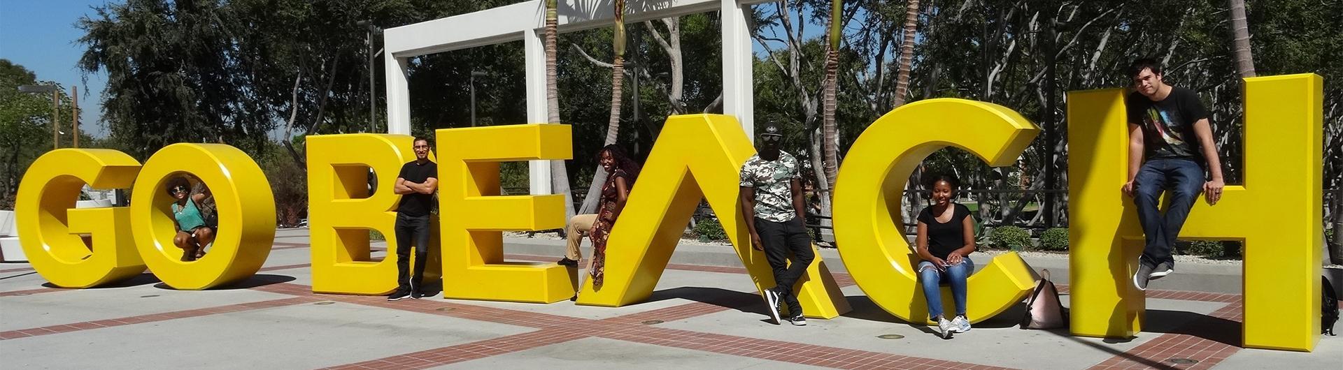 students on the GO BEACH art installation