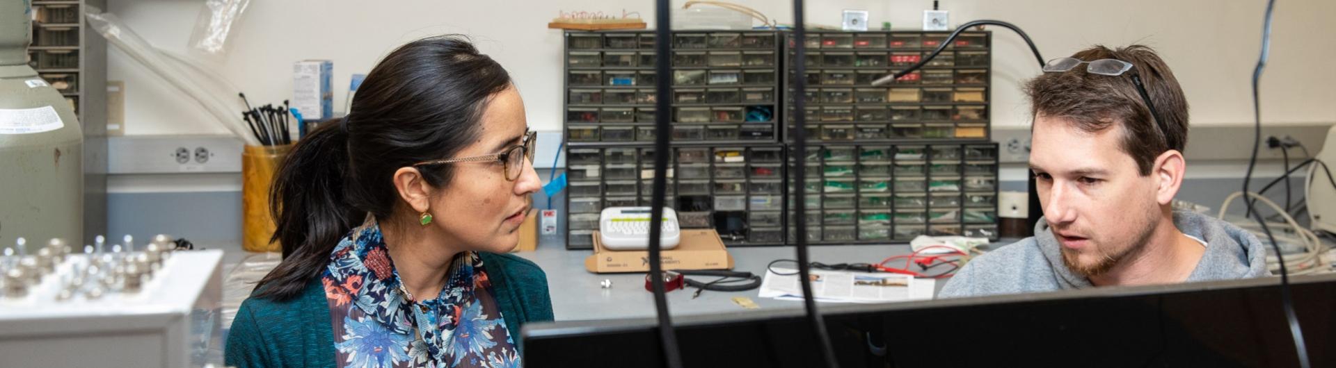 professor working with student in lab