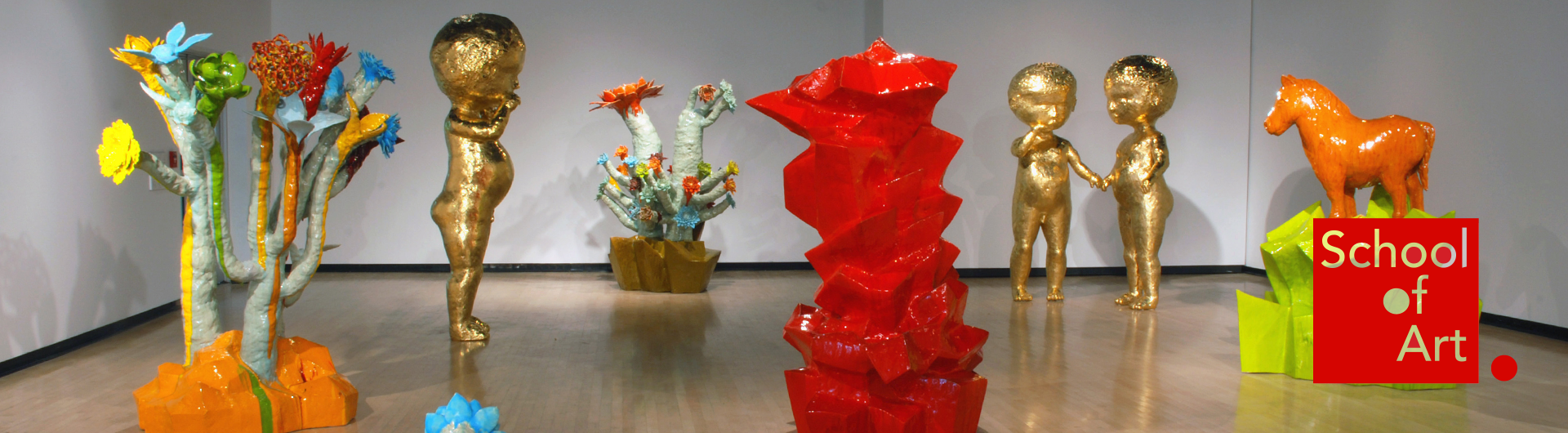 Large, colorful sculptures on display in an art gallery