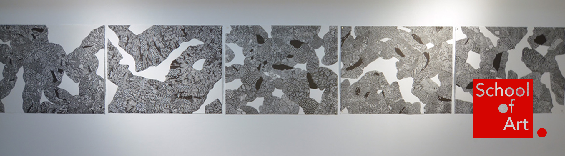 Five black and white prints displayed side by side on a gallery wall