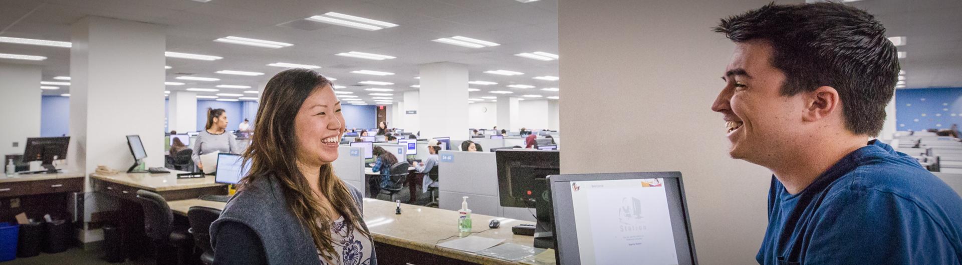 A student receives help at a University Library help desk