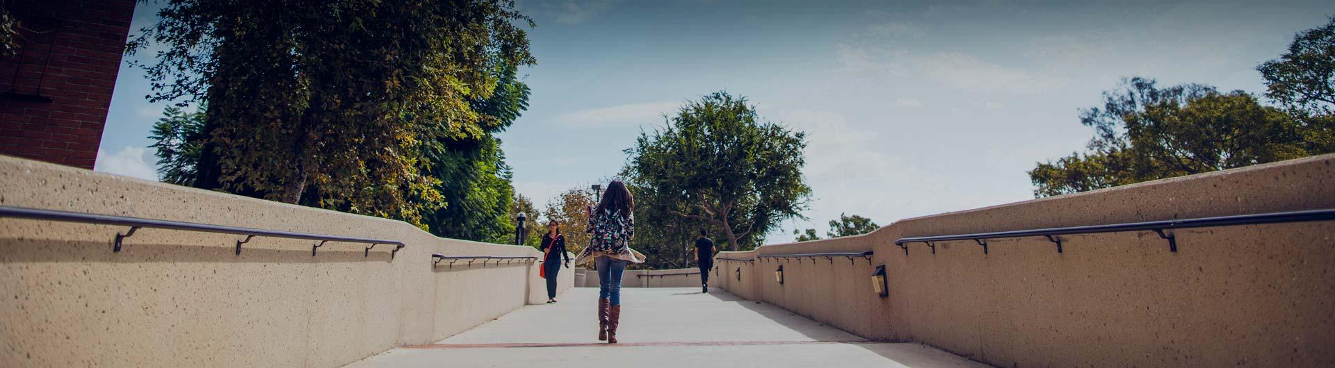 CSULB Students walking on bridge