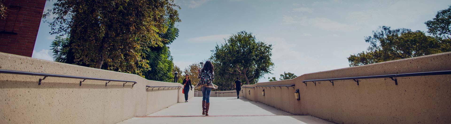 Students walking on bridge
