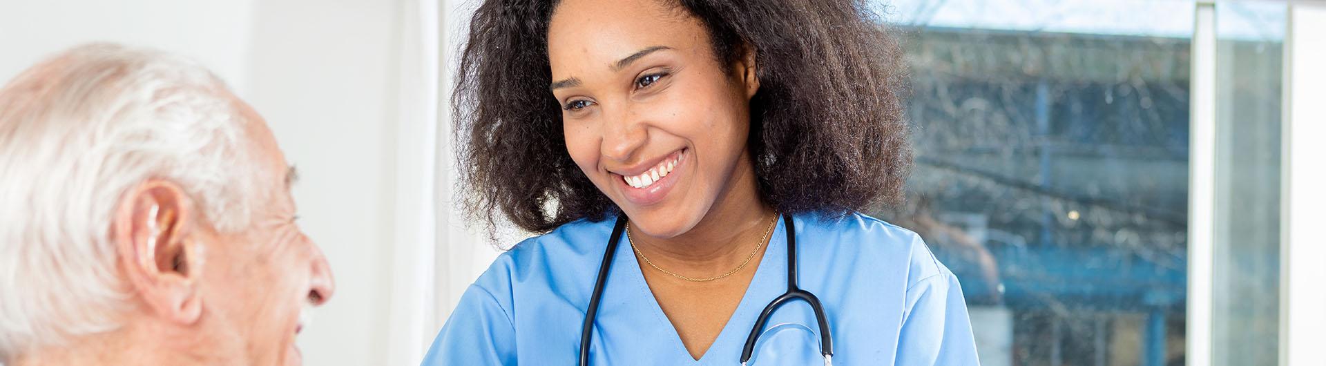 Nurse caring for elderly patient