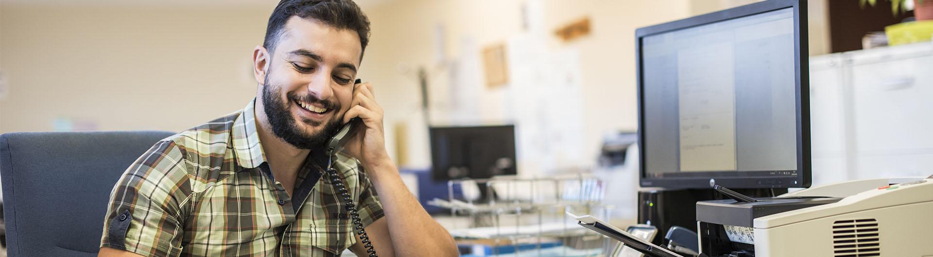 Business man in office talking on the phone