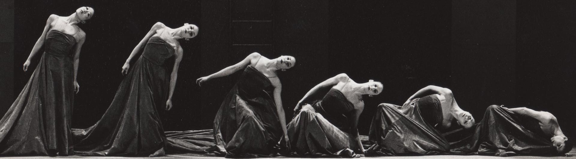 Five dancers lowering to the floor from "Odysee"