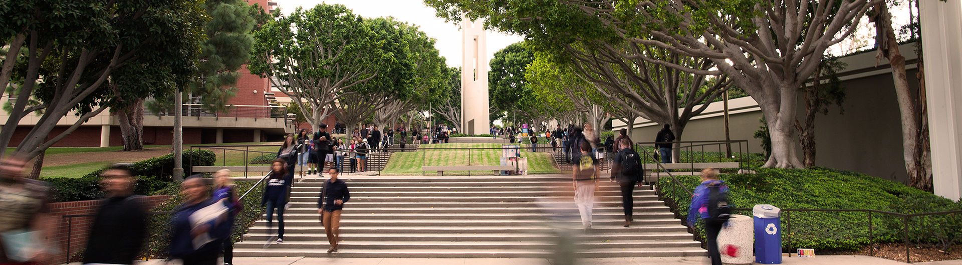 Students walking up steps on campus by Carlson Memorial Tower