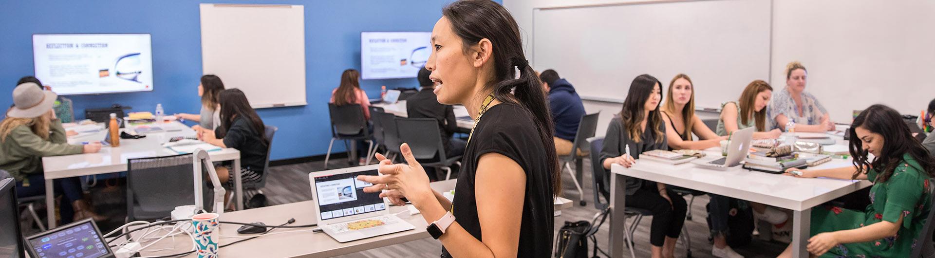 faculty teaching in a high tech classroom