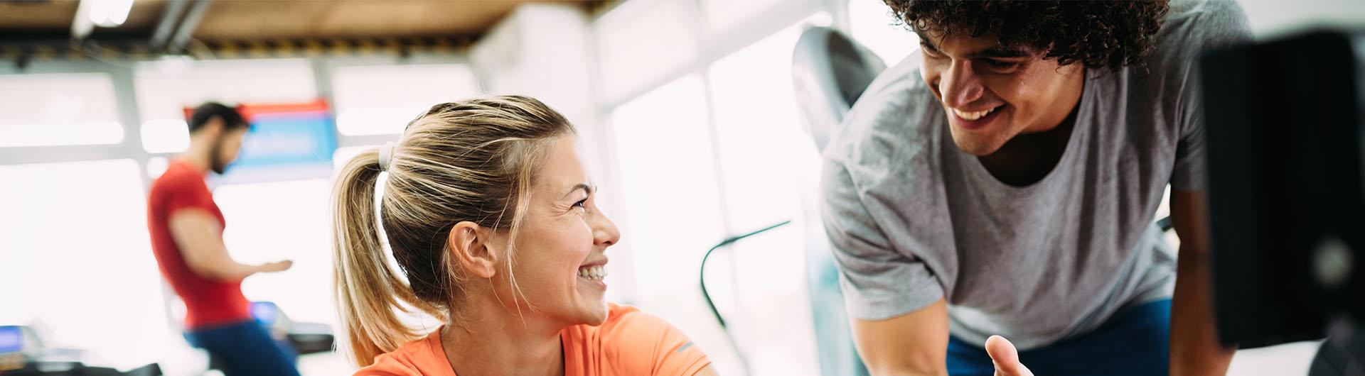 Fitness trainer working with client