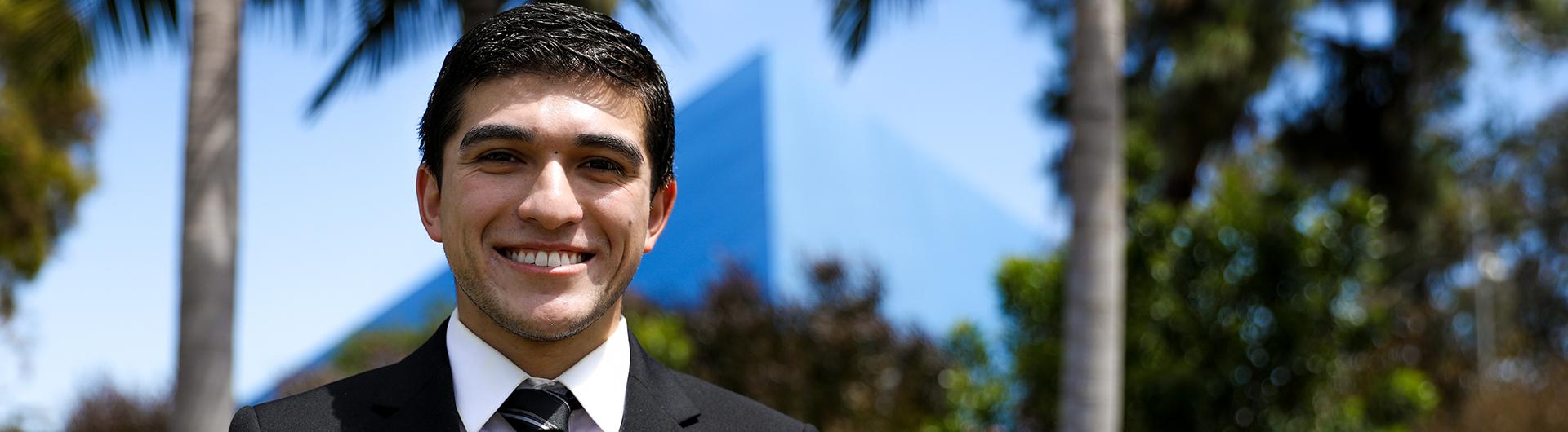 MBA Student smiling in front of the Pyramid