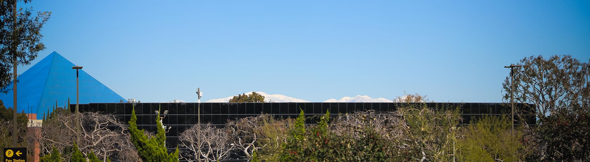 Banner PHOTO of campus includes pyramid and corn on the cob building