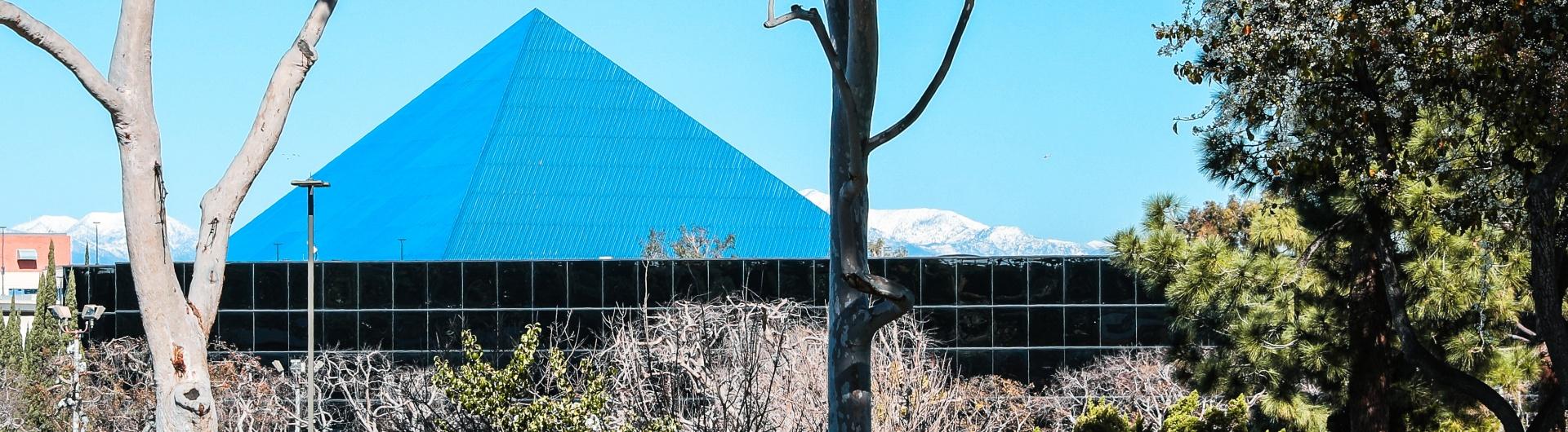 Banner PHOTO of campus includes pyramid and corn on the cob building