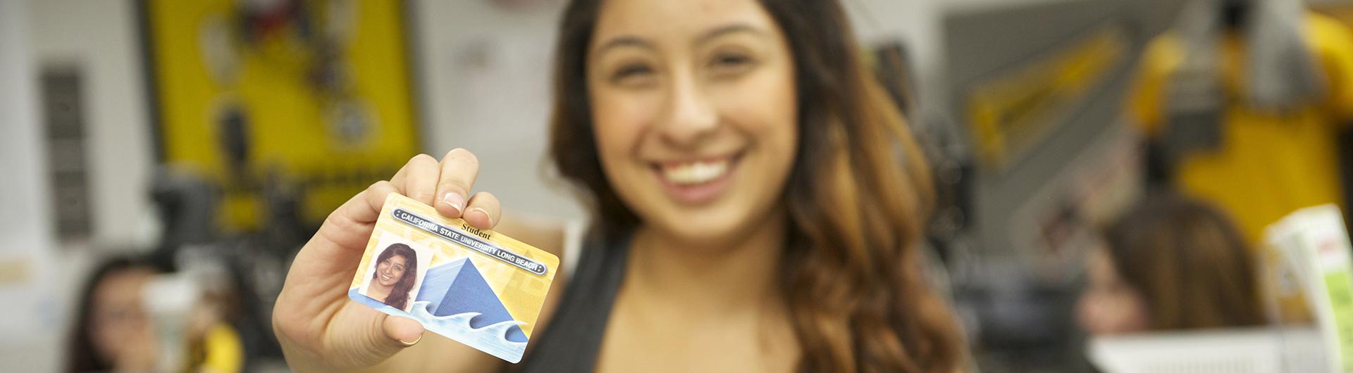 girl smiling with id card