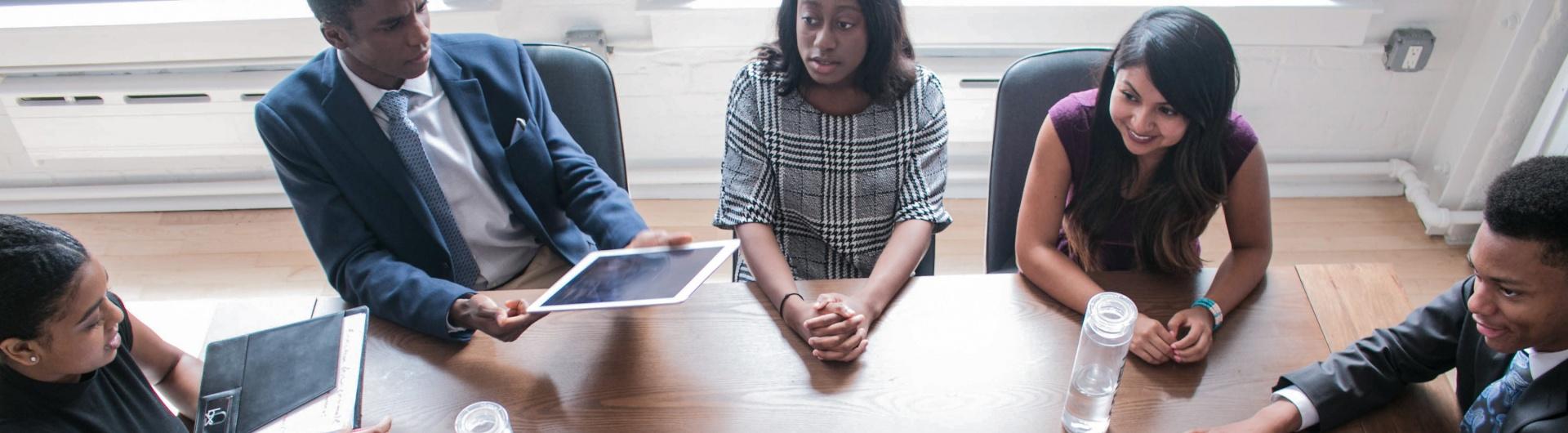 people sitting around a conference table