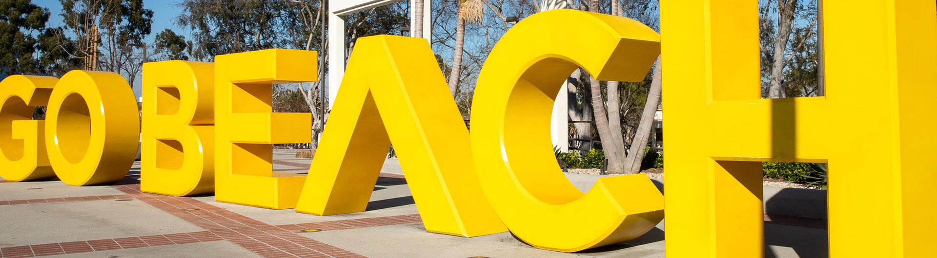 The yellow Go Beach sign at Cal State Long Beach
