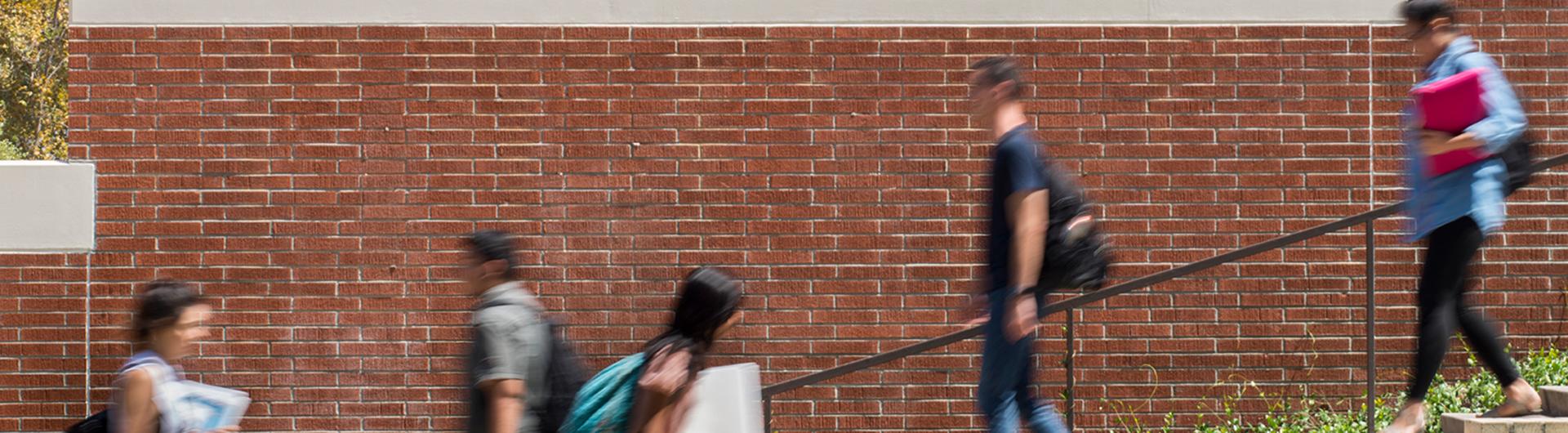 students walking on campus 