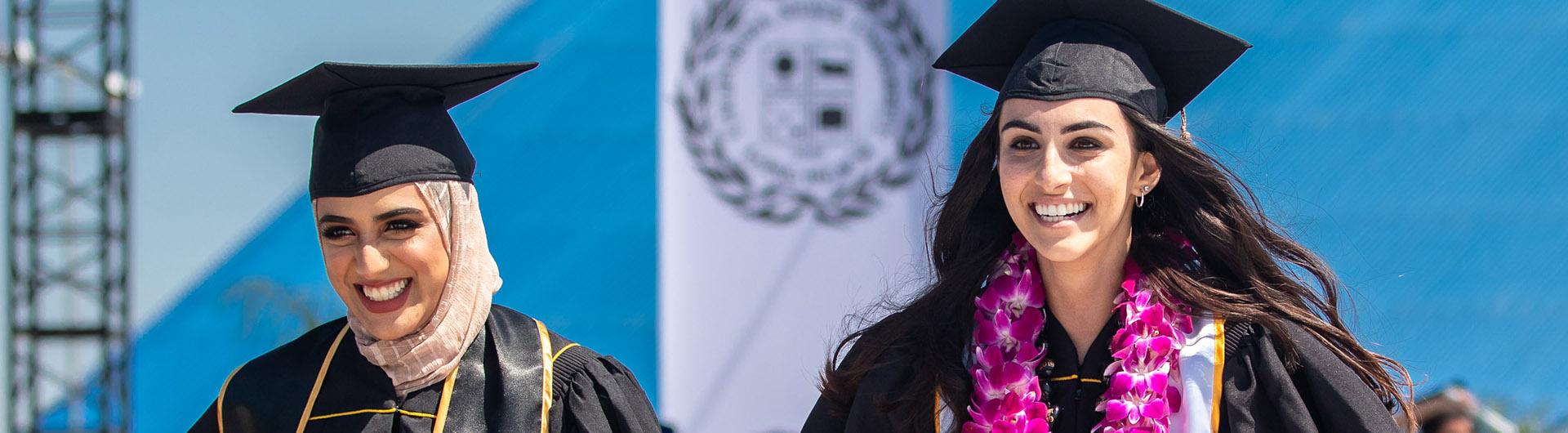 graduates smiling