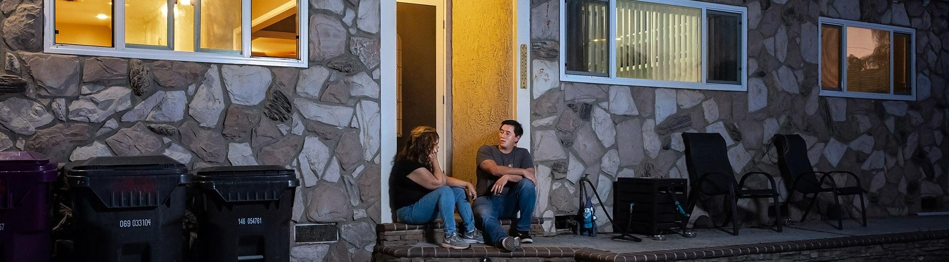 Ethan Saucer sits on porch