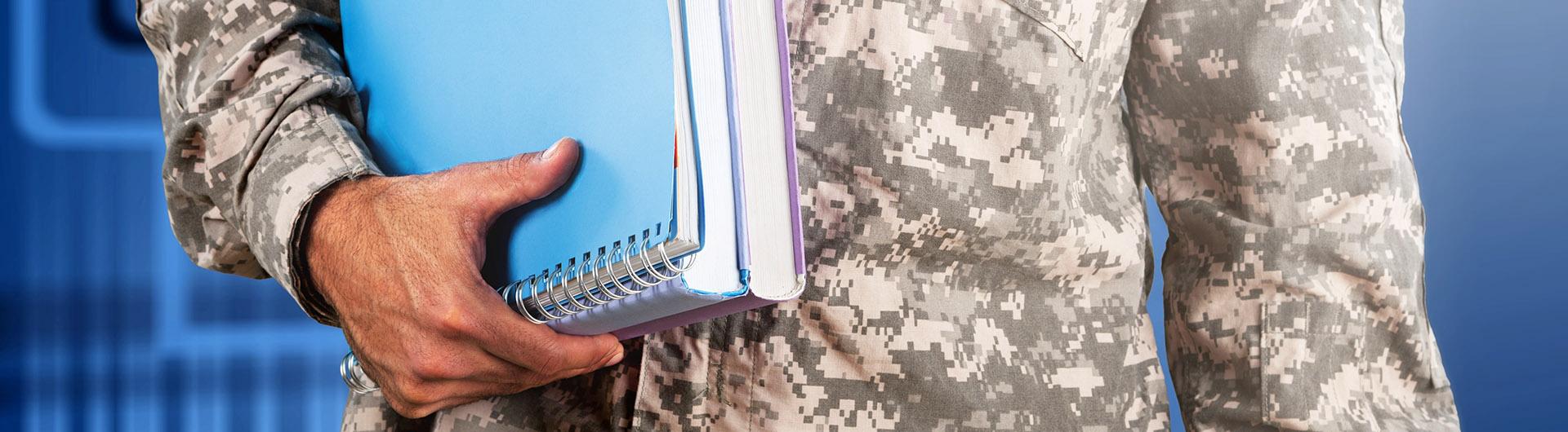 Veteran holding books