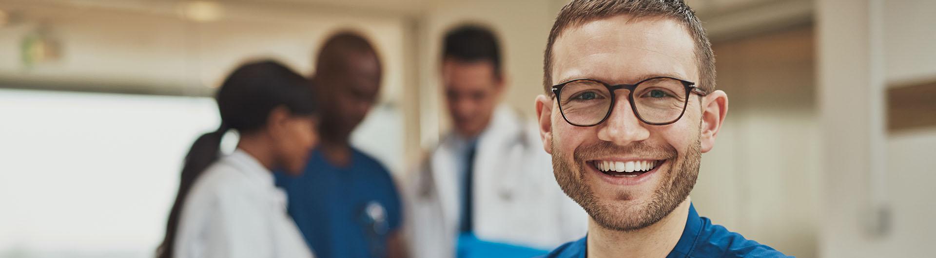 Male nurse standing in front of doctor