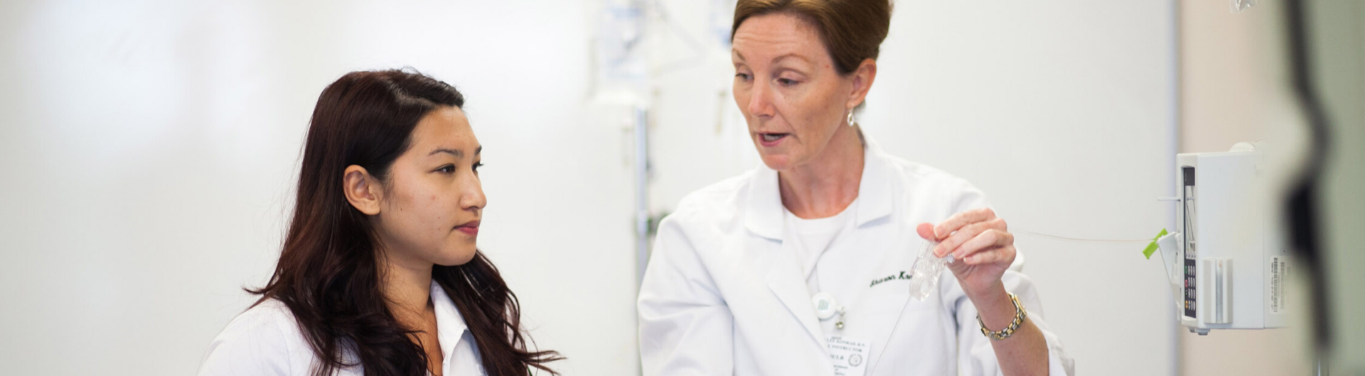 Nursing Professor instructing student