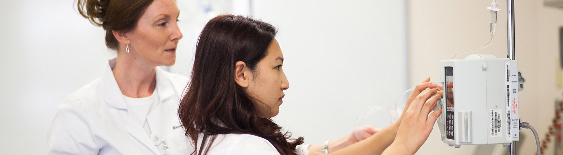 student nurse adjusts diagnostic tool